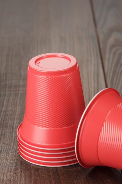 stack-of-red-plastic-cups-on-the-table-compressed
